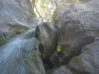 Rappelling down a waterfall