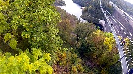 Ziplining beside suspension bridge