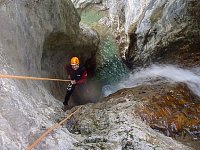 Abseil next to a small waterfall