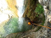 Abseil close to a waterfall near Tremosine