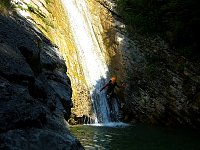Abseil slide on canyoning tour