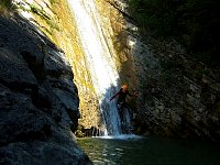 Abseil slide on canyoning tour