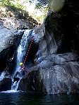 Abseil down small waterfall