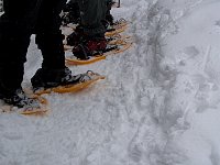 Putting on snow shoes