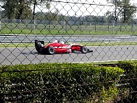 Formula 3 car past Ascari corner