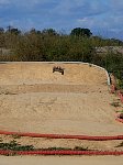 Model car on dirt track