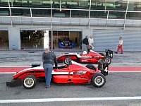 Formula 3 cars parked at Monza pit lane