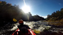 Paddling down a rapid