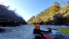 Paddling down a rapid