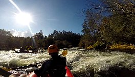 Paddling down a rapid