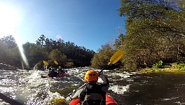 Paddling down a rapid