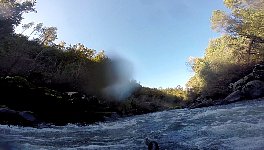 Paddling down a rapid