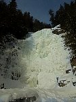 Ice climbers near frozen waterfall