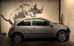 Rhino on car at Banksy museum in Madrid