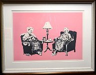 Framed stencil art at Banksy museum in Madrid