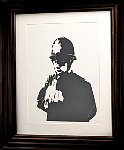 Framed stencil art at Banksy museum in Madrid
