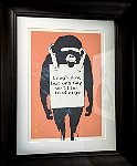 Framed stencil art at Banksy museum in Madrid