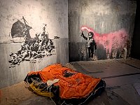 Refugee graffiti at Banksy museum in Madrid