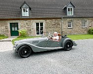 Morgan car, me and cottage