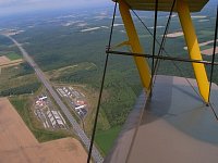 Tiger Moth above highway service station