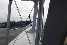 Spitfire close to Dragon Rapide