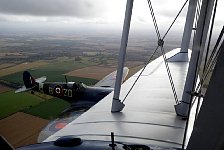 Spitfire with open cockpit close to Dragon Rapide