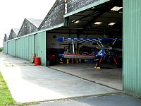 Old hangar with biplane