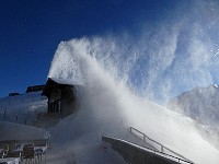 Snow thrower in action