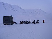 Snowmobiles at hut
