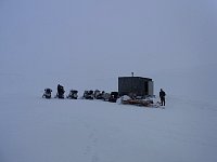 Hut and snowmobiles 