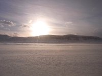 Snow blown over ice