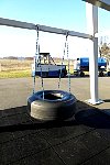 Tire swing and baggage tractor