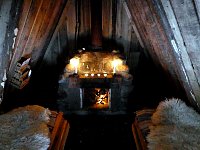 Hut interior with fire lit