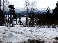 Snowmobile approaching from lake