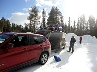 Car and sleds and dogs ready to go