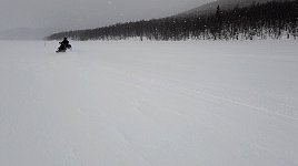 Snowmobile on snowy lake