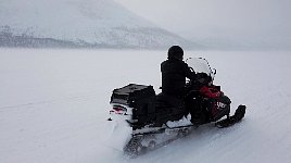 Snowmobile on snowy lake
