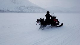 Snowmobile on snowy lake