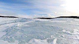 Lake with broken ice surface
