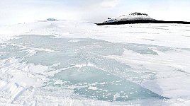 Lake with broken ice surface