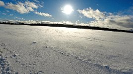 Snow blown over lake surface