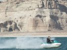 Jet ski passing Lake Powell rocks